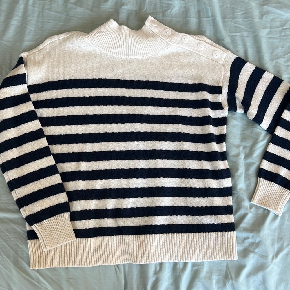 Blue and cream colored sweater. Size small.